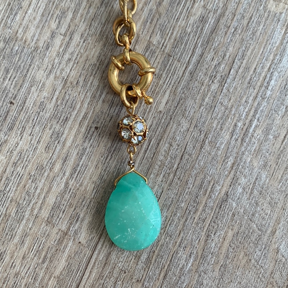 Gold necklace with decorative drop